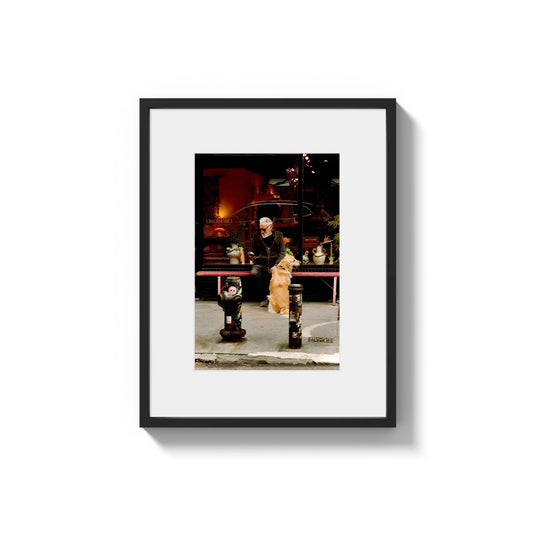 Candid City Moment: A man with a dog - Framed Photography Print